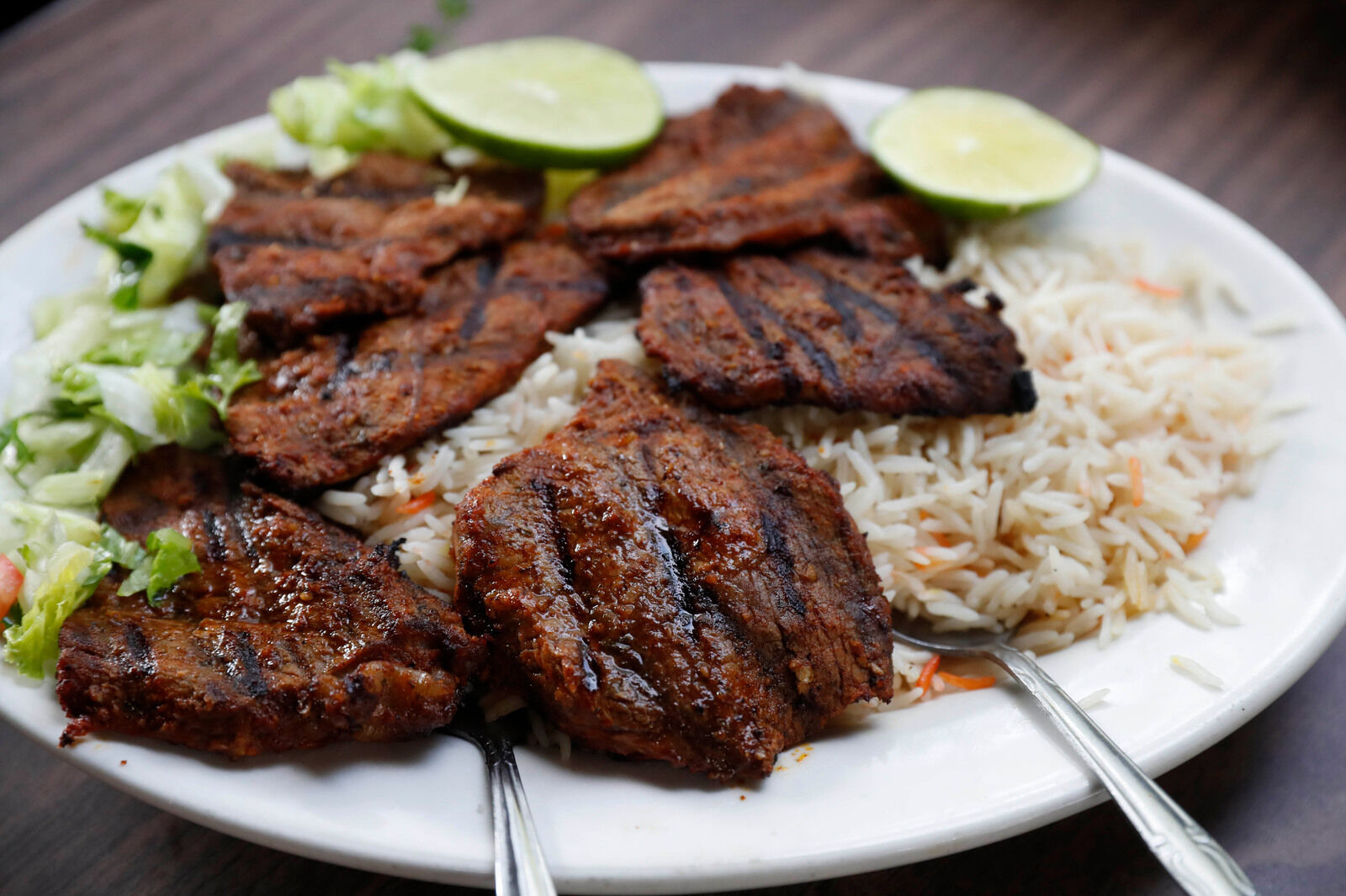 Lamb kebab over rice